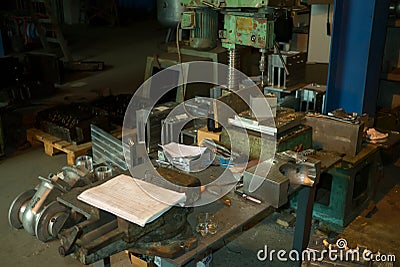 Old equiped metalworking workshop with obsolete tools Stock Photo