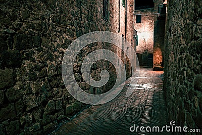 Old European narrow empty street of a medieval town at evening. Stock Photo