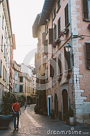 Old European street with architecture in italy in the evening on the shores of Lake Lago di garda Editorial Stock Photo