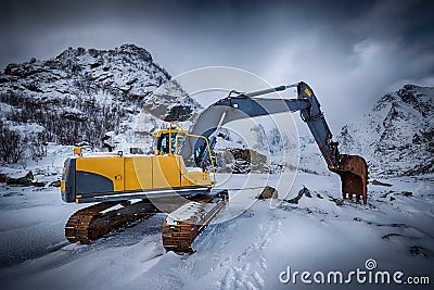 Old excavator in winter Stock Photo