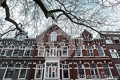 Old facade of a two-story building in Rotterdam, Belgium. Stock Photo
