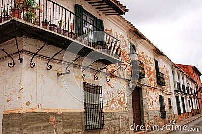 Old facades, balconies and vintage lanterns in Villanueva de los Infantes, Spain Stock Photo