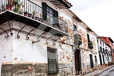 Old facades, balconies and vintage lanterns in Villanueva de los Infantes, Spain Editorial Stock Photo