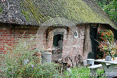 Old dutch farm barn with thatched roof Stock Photo