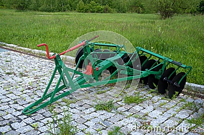 Old farm tiller. Stock Photo