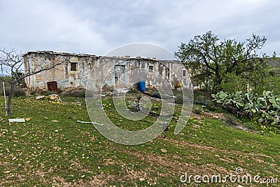Old farmhouse in the middle of an almond field Stock Photo