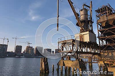 Old fashion rusty Port grain elevator. Industrial sea trading port bulk cargo zone in Rotterdam harbour Stock Photo
