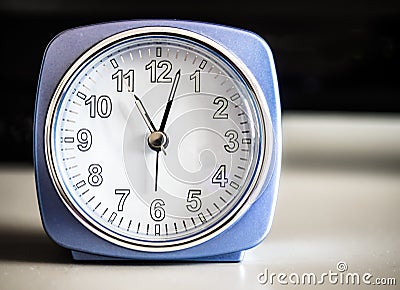 Old fashioned azure morning alarm clock Stock Photo