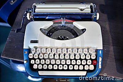 Old fashioned blue, white typewriter Stock Photo