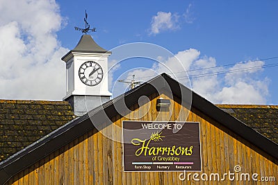 An old fashioned clock tower with a weather on a garden centre store near Kircubbin in Northern Ireland Editorial Stock Photo