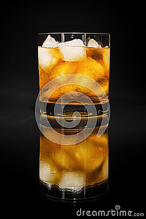 Old fashioned cognac glass on the black background Stock Photo