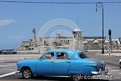 Old fashioned Cuban car and the Castle of the Royal Force, Havana Editorial Stock Photo