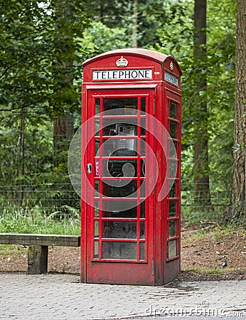 Old fashioned dusty and weathered british phone box Stock Photo