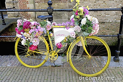 Old-fashioned Dutch city bike near a bridge over canal Stock Photo