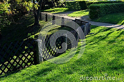 old-fashioned garden fencing. stone posts with mortise directly from Stock Photo