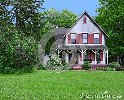 Old fashioned house with a large porch Stock Photo