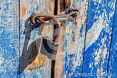 The old-fashioned latch on the door, the old castle, retro style Stock Photo