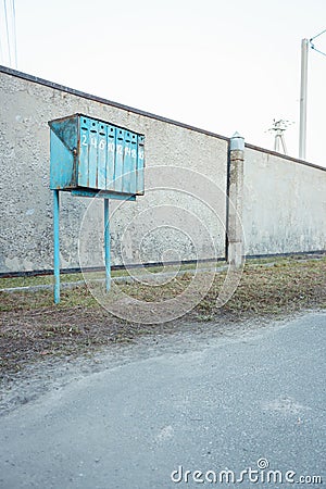 Old fashioned mail box. Row of blue postbox. Letter box with numbers. Retro postal storage. Outdoor mailbox. Stock Photo