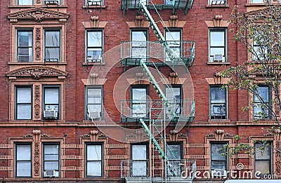 Old fashioned New York apartment building with ornate window frames Stock Photo