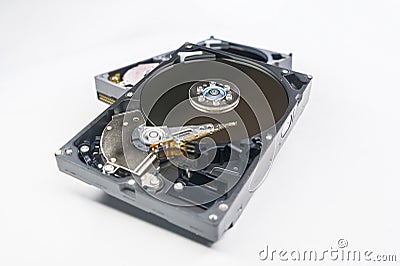 Old fashioned, open, mechanical harddisc drive, isolated on a white background Stock Photo