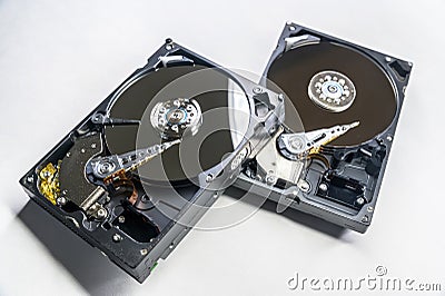 Old fashioned, open, mechanical harddisc drives, isolated on a white background Stock Photo