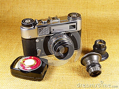 Old-fashioned photo-camera and accessories Stock Photo
