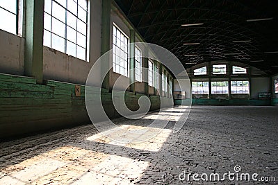 Old fashioned riding hall with sandy covering without people Stock Photo