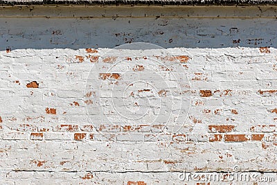 Old fashioned surface of wall with bricks and white stucco Stock Photo