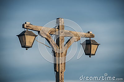 Old fashioned wooden street light with two lamps Stock Photo