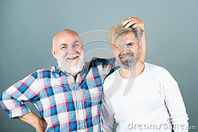 Old father and son. Elderly grandfather. Senior man Granddad. Older younger generations. Stock Photo