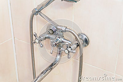 Old faucet the faucet Assembly in the bathroom. Limescale on chrome taps and mixer shower Stock Photo