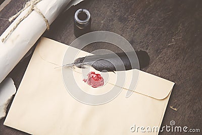 Old feather, envelope, sealing wax Stock Photo