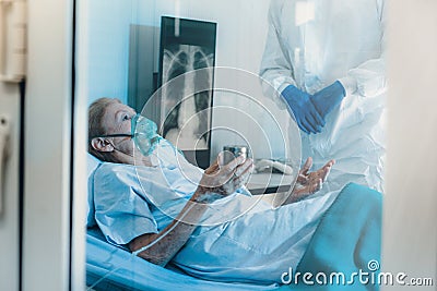 Old Female patients despaired in hospital beds Stock Photo