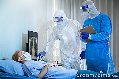 Old Female patients despaired in hospital beds Stock Photo