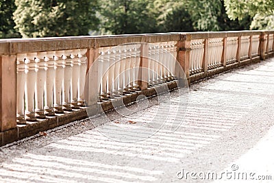 Old fence columns in the garden background. Repeating columns in perspective Stock Photo