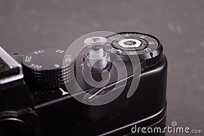 Old film SLR camera, shutter cocking wheel, frame counter and shutter button Editorial Stock Photo
