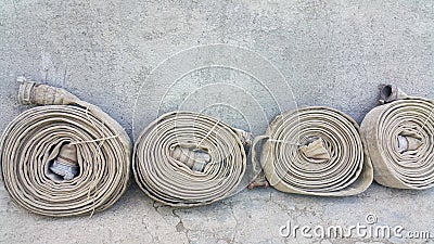 Old fire hoses close-up, including aluminum piping Stock Photo