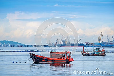 Old fishing boat, beautiful color, near the big pier on a bright day. Editorial Stock Photo