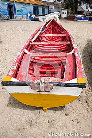 Old fishing boat on the shore. Boat with nets waiting for fishermen on the beach of Cape Verde Editorial Stock Photo