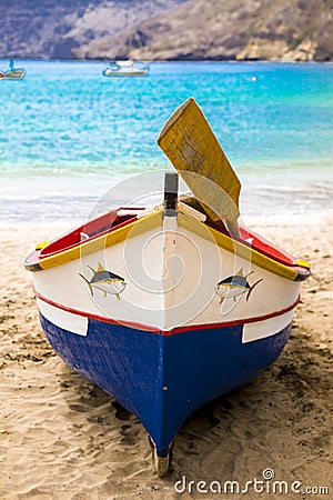 Old fishing boat on the shore. Boat with nets waiting for fishermen on the beach of Cape Verde Editorial Stock Photo