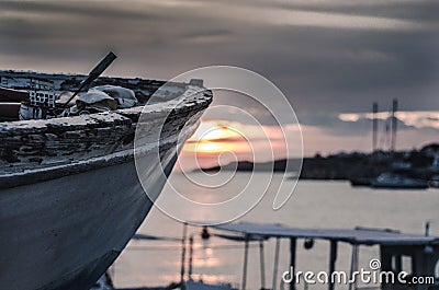 Old fishing boat on sunset Stock Photo