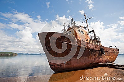 Old fishing vessel on the sea coast Stock Photo