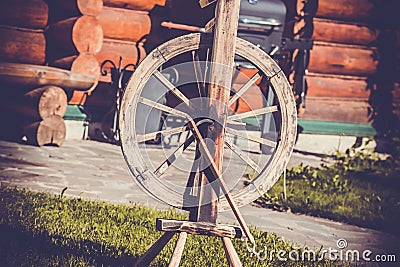 Old folk wooden vintage peasant spinning wheel Stock Photo