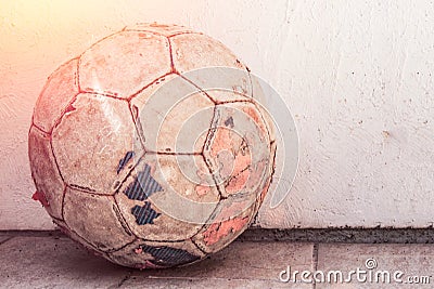 Old football m`yach standing on the ground, street football Stock Photo