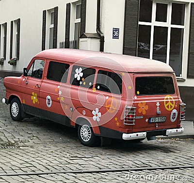 Old Ford van painted with symbols of peace and goodness, youth culture of Latvia appreciates retro style Editorial Stock Photo