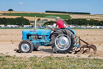Old fordson dexter tractor ploughing Editorial Stock Photo