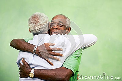 Old friends, two senior african american men meeting and hugging Stock Photo