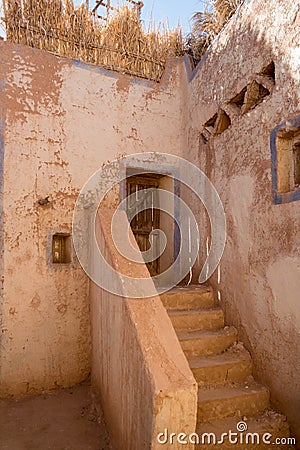 Old front door with stairs in an ancient village Stock Photo