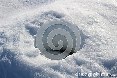 Old Frozen Ice Fishing Hole Stock Photo