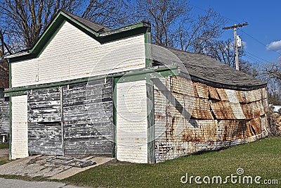 Old garage with disintegrating metal siding Stock Photo